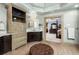 Spacious bathroom featuring custom cabinetry, a marble countertop, with view to main bedroom at 225 Cotton Field Ct, Alpharetta, GA 30022
