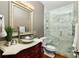 Modern bathroom with glass shower, designer vanity, and updated fixtures offer a spa-like experience at 225 Cotton Field Ct, Alpharetta, GA 30022