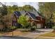 Red brick two-story home with mature landscaping and a two-car garage at 225 Cotton Field Ct, Alpharetta, GA 30022