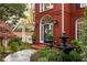 Brick facade and a flagstone walkway with a water feature lead up to the front entrance at 225 Cotton Field Ct, Alpharetta, GA 30022
