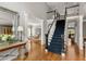 Bright foyer with hardwood floors, staircase, and elegant decor creating a welcoming entrance to the home at 225 Cotton Field Ct, Alpharetta, GA 30022