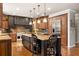 Expansive kitchen features a central island, stainless steel appliances, and plentiful cabinet space at 225 Cotton Field Ct, Alpharetta, GA 30022