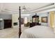 Bright main bedroom featuring a fireplace, seating area, and plush carpeting at 225 Cotton Field Ct, Alpharetta, GA 30022