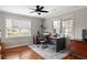 Bright office with hardwood floors, ceiling fan, two large windows and neutral walls at 225 Cotton Field Ct, Alpharetta, GA 30022