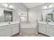 Relaxing bathroom with corner soaking tub, double vanity sinks, and a window with lots of natural light at 2319 White Alder Dr, Buford, GA 30519