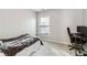 Bedroom with neutral walls, carpet, natural light, and desk area at 2319 White Alder Dr, Buford, GA 30519