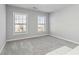 Bright, carpeted bedroom with large windows that let in natural light at 2319 White Alder Dr, Buford, GA 30519