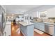 Charming kitchen with granite countertops, stainless steel appliances, and breakfast bar overlooking the living room at 2319 White Alder Dr, Buford, GA 30519