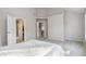 Large main bedroom with en suite bathroom and walk in closet at 2319 White Alder Dr, Buford, GA 30519
