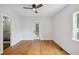 Minimalist bedroom with hardwood floors, a ceiling fan and a door to the exterior at 404 Princeton Ne Way, Atlanta, GA 30307