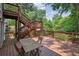 Wooden deck with stairs overlooking the lush backyard at 404 Princeton Ne Way, Atlanta, GA 30307