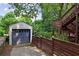 One car detached garage with driveway and wooden fence at 404 Princeton Ne Way, Atlanta, GA 30307
