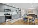 Modern eat-in kitchen with gray cabinetry and stainless appliances at 404 Princeton Ne Way, Atlanta, GA 30307