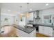 Bright open kitchen with an island, stainless steel appliances, and hardwood floors at 404 Princeton Ne Way, Atlanta, GA 30307