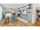 Open concept living space with kitchenette, hardwood floors, and bedroom area at 404 Princeton Ne Way, Atlanta, GA 30307