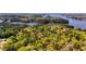 Breathtaking aerial shot of lush forests cascading towards the serene waters of Lake Hartwell at 416 Blue Sky Cir, Acworth, GA 30102