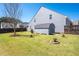 View of the spacious backyard, with mature trees, and a wooden storage shed at 416 Blue Sky Cir, Acworth, GA 30102