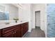 Bathroom featuring double vanity, storage, and tiled shower at 416 Blue Sky Cir, Acworth, GA 30102