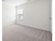 Empty bedroom featuring neutral carpet and a bright window at 416 Blue Sky Cir, Acworth, GA 30102