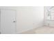 Bright, carpeted bedroom with a large window and a door for ample space and natural light at 416 Blue Sky Cir, Acworth, GA 30102