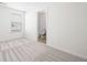 Bright bedroom with neutral carpet and a view into the bathroom at 416 Blue Sky Cir, Acworth, GA 30102