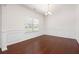 Elegant dining room with hardwood floors, wainscoting, and chandelier at 416 Blue Sky Cir, Acworth, GA 30102