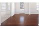 Inviting foyer with dark wood floors, wainscoting, and plenty of natural light at 416 Blue Sky Cir, Acworth, GA 30102