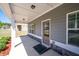 Inviting covered porch with stone accents and neutral siding creates a warm welcome at 416 Blue Sky Cir, Acworth, GA 30102