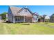 Well-maintained yard and covered porch enhancing the curb appeal of this beautiful home at 416 Blue Sky Cir, Acworth, GA 30102