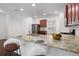 Stylish kitchen with a large island, breakfast bar seating, granite countertops, and stainless steel appliances at 416 Blue Sky Cir, Acworth, GA 30102