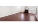 Spacious living room with dark hardwood floors and a cozy fireplace at 416 Blue Sky Cir, Acworth, GA 30102