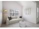 Cozy living room with couch and artwork, and ample sunlight at 416 Blue Sky Cir, Acworth, GA 30102