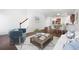 Comfortable living room featuring hardwood floors, stairs, and an adjacent kitchen area at 416 Blue Sky Cir, Acworth, GA 30102
