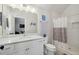 Bathroom with a subway tiled shower, a marble countertop, and decorative artwork at 530 Bismark Ne Rd, Atlanta, GA 30324