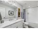 Bathroom features a marble vanity, modern lighting fixtures, and a tiled shower/tub at 530 Bismark Ne Rd, Atlanta, GA 30324