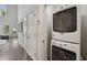 Hallway laundry with a stacked washer and dryer at 530 Bismark Ne Rd, Atlanta, GA 30324