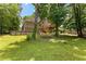 Backyard of home showcasing above-ground pool, deck and landscaped surroundings at 9283 Whaleys Lake Ln, Jonesboro, GA 30238