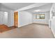 Finished basement with neutral carpet, white walls, closet, and a small window at 9283 Whaleys Lake Ln, Jonesboro, GA 30238
