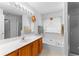 Bathroom featuring a bathtub and shower combo with a glass door at 9283 Whaleys Lake Ln, Jonesboro, GA 30238