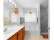 Bathroom featuring a bathtub and shower combo with a glass door at 9283 Whaleys Lake Ln, Jonesboro, GA 30238