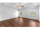 Spacious main bedroom featuring hardwood floors and a ceiling fan at 9283 Whaleys Lake Ln, Jonesboro, GA 30238