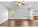 Bright bedroom with hardwood floors, neutral walls, and two windows with natural light at 9283 Whaleys Lake Ln, Jonesboro, GA 30238