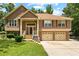 Inviting two-story home with a well-manicured lawn and a two-car garage, perfect for suburban living at 9283 Whaleys Lake Ln, Jonesboro, GA 30238