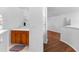 Hallway featuring built-in shelving and hardwood floors at 9283 Whaleys Lake Ln, Jonesboro, GA 30238