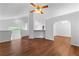 Open-concept living room featuring vaulted ceilings, wood-look flooring, and arched doorways at 9283 Whaleys Lake Ln, Jonesboro, GA 30238