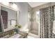 Bathroom featuring a single sink vanity with granite countertop and a shower with a tub at 1450 Oglethorpe Sw Ave, Atlanta, GA 30310