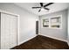 Bedroom featuring hardwood floors, a ceiling fan, and a double door closet at 1450 Oglethorpe Sw Ave, Atlanta, GA 30310