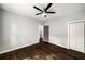 Bedroom featuring hardwood floors, a ceiling fan and an open doorway at 1450 Oglethorpe Sw Ave, Atlanta, GA 30310