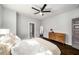 Well-lit bedroom features a ceiling fan, hardwood floors, and modern furnishings for comfortable living at 1450 Oglethorpe Sw Ave, Atlanta, GA 30310