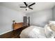 Comfortable bedroom featuring hardwood floors, neutral decor and ample natural light at 1450 Oglethorpe Sw Ave, Atlanta, GA 30310